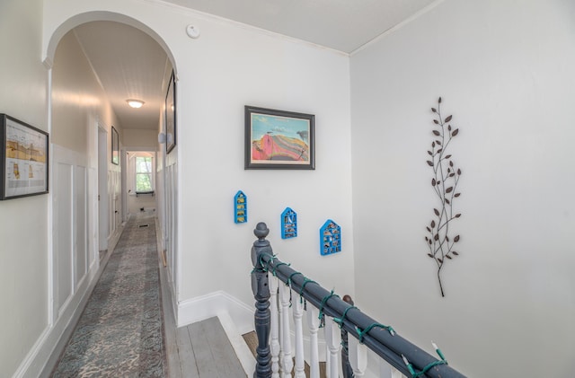 29 Zions Hill Rd, Dexter, ME 04930 - hallway featuring arched walkways, ornamental molding, and wood finished floors