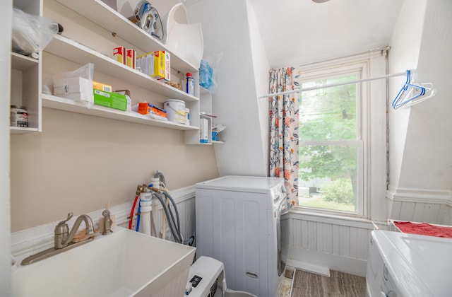 29 Zions Hill Rd, Dexter, ME 04930 - laundry area with washing machine and dryer, healthy amount of natural light, and wainscoting