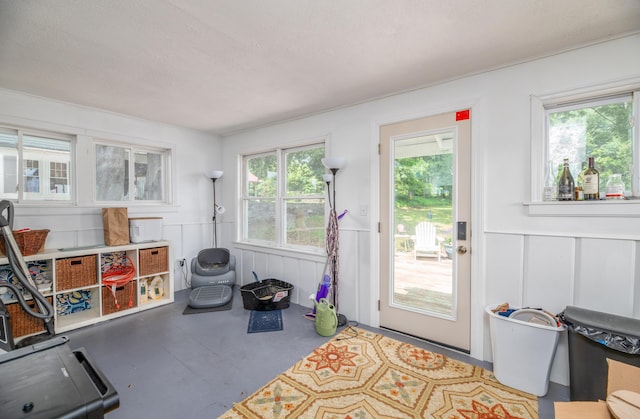 29 Zions Hill Rd, Dexter, ME 04930 - entryway featuring a decorative wall, wainscoting, plenty of natural light, and a textured ceiling