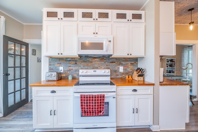 29 Zions Hill Rd, Dexter, ME 04930 - kitchen featuring white appliances, butcher block counters, white cabinetry, tasteful backsplash, and ornamental molding