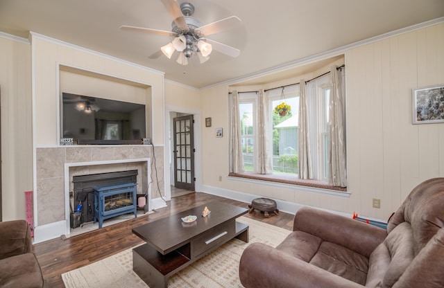 29 Zions Hill Rd, Dexter, ME 04930 - living room with ceiling fan, crown molding, wood finished floors, and a glass covered fireplace