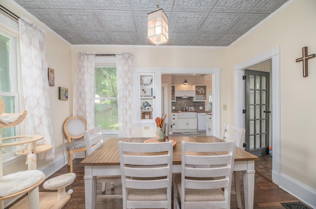 29 Zions Hill Rd, Dexter, ME 04930 - dining room featuring dark wood-style floors, an ornate ceiling, and crown molding