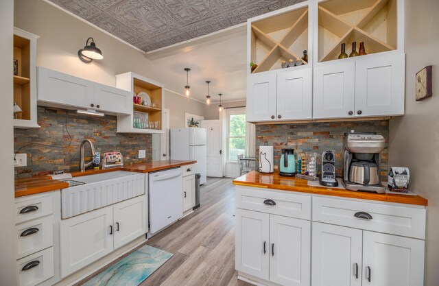 29 Zions Hill Rd, Dexter, ME 04930 - kitchen with butcher block countertops, open shelves, white appliances, an ornate ceiling, and light wood finished floors
