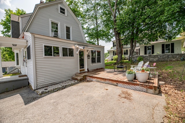 29 Zions Hill Rd, Dexter, ME 04930 - back of house featuring a wooden deck and a gambrel roof
