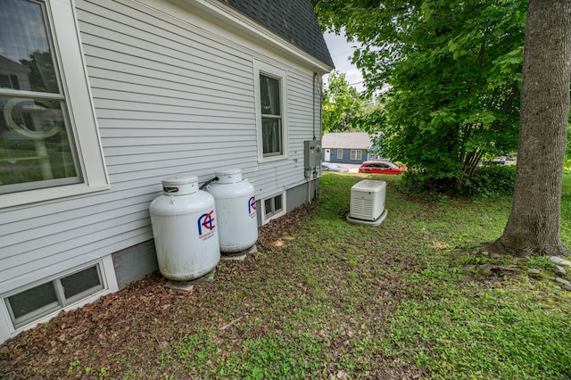 29 Zions Hill Rd, Dexter, ME 04930 - view of side of home with roof with shingles and a lawn