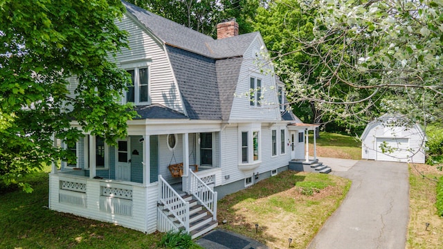 29 Zions Hill Rd, Dexter, ME 04930 - dutch colonial featuring a gambrel roof, an outdoor structure, a porch, and roof with shingles
