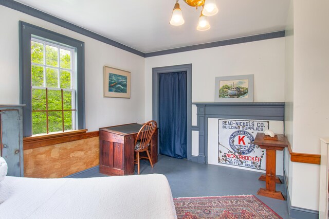 511 Main Rd, Phippsburg, ME 04562 - bedroom with finished concrete floors, multiple windows, and a chandelier