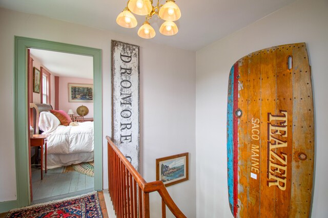 511 Main Rd, Phippsburg, ME 04562 - corridor featuring a chandelier, wood finished floors, and an upstairs landing