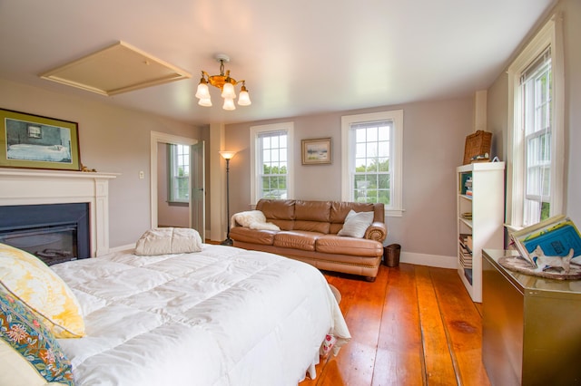 511 Main Rd, Phippsburg, ME 04562 - bedroom featuring hardwood / wood-style flooring and a glass covered fireplace