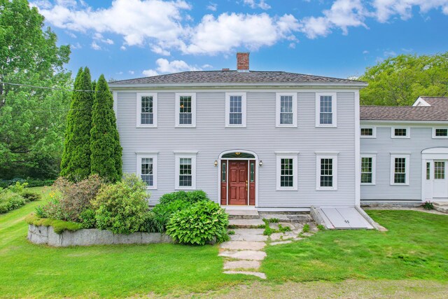 511 Main Rd, Phippsburg, ME 04562 - colonial inspired home featuring a chimney and a front lawn