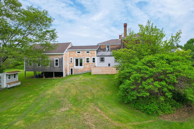 511 Main Rd, Phippsburg, ME 04562 - rear view of property featuring a yard and a chimney