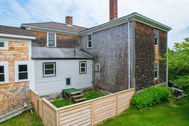 511 Main Rd, Phippsburg, ME 04562 - rear view of house featuring a chimney and roof with shingles