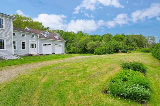 511 Main Rd, Phippsburg, ME 04562 - view of green lawn with driveway and an attached garage