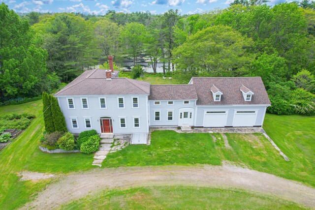 511 Main Rd, Phippsburg, ME 04562 - view of front of property featuring driveway, a front yard, a chimney, and a forest view