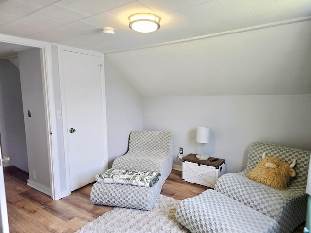 351 Maple St, Bangor, ME 04401 - sitting room featuring wood finished floors, vaulted ceiling, and baseboards