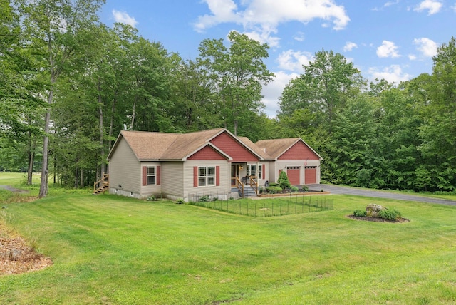 31 Knight Way N, Yarmouth, ME 04097 - view of front of house with a garage, asphalt driveway, and a front lawn