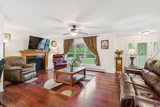 31 Knight Way N, Yarmouth, ME 04097 - living area with baseboard heating, a fireplace with flush hearth, a ceiling fan, and hardwood / wood-style flooring