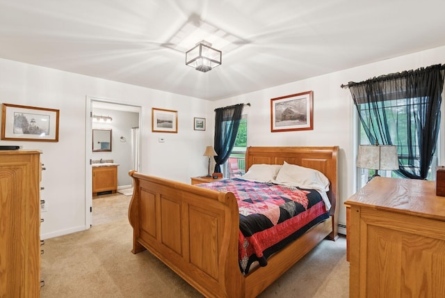 31 Knight Way N, Yarmouth, ME 04097 - bedroom featuring light carpet, multiple windows, ensuite bathroom, and a baseboard radiator