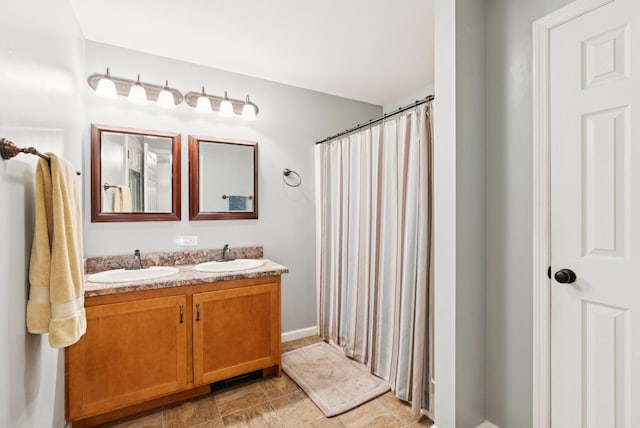 31 Knight Way N, Yarmouth, ME 04097 - full bathroom with double vanity, a shower with shower curtain, and stone finish floors