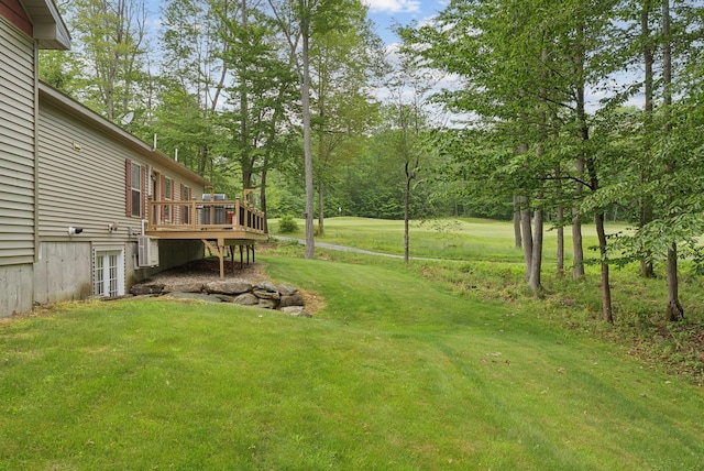 31 Knight Way N, Yarmouth, ME 04097 - view of grassy yard featuring a wooden deck and view of scattered trees