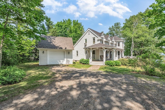 27 Highview Ter, Belfast, ME 04915 - view of front of house with covered porch, dirt driveway, an outdoor structure, roof with shingles, and an attached garage