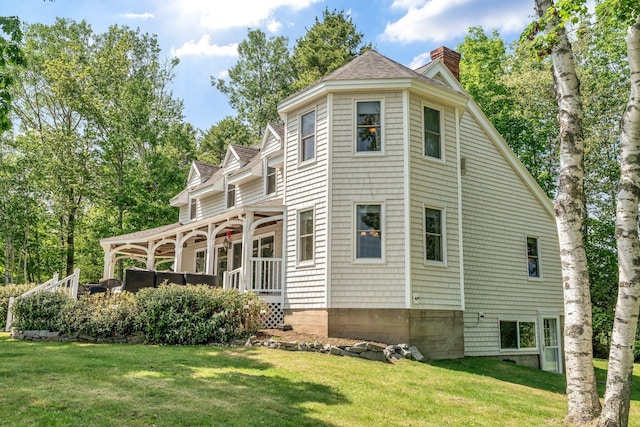 27 Highview Ter, Belfast, ME 04915 - view of side of property featuring a chimney and a lawn