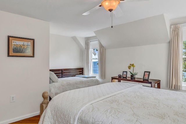 27 Highview Ter, Belfast, ME 04915 - bedroom featuring multiple windows, wood finished floors, ceiling fan, and vaulted ceiling