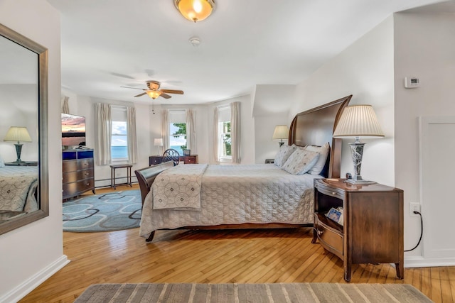 27 Highview Ter, Belfast, ME 04915 - bedroom featuring a baseboard heating unit and hardwood / wood-style flooring