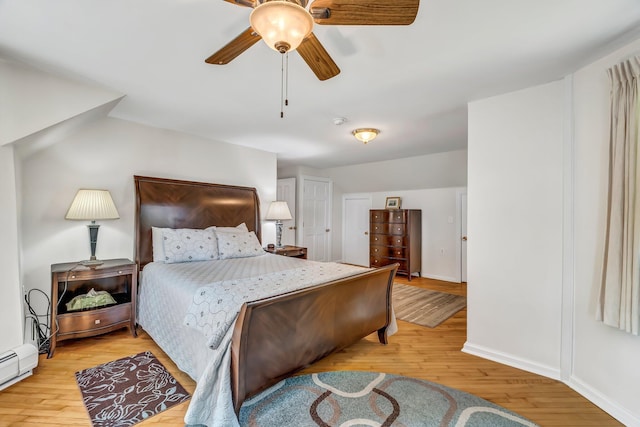 27 Highview Ter, Belfast, ME 04915 - bedroom with light wood-style flooring, ceiling fan, and a baseboard radiator