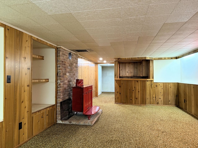 190 Belfast Rd, Camden, ME 04843 - finished basement with wood walls, a wood stove, and carpet