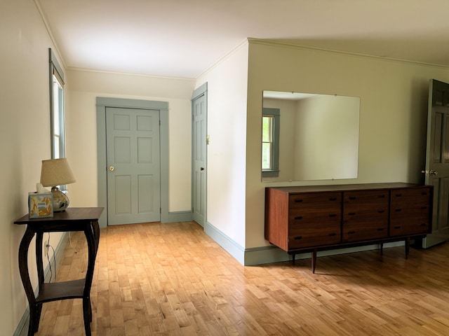 190 Belfast Rd, Camden, ME 04843 - entryway with crown molding, light wood-style floors, and healthy amount of natural light