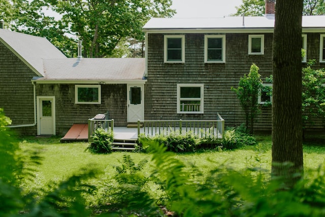 190 Belfast Rd, Camden, ME 04843 - rear view of property featuring a chimney, a deck, and a lawn