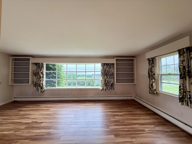 54 Pine Ledge Rd, Bangor, ME 04401 - empty room featuring a baseboard heating unit and wood finished floors