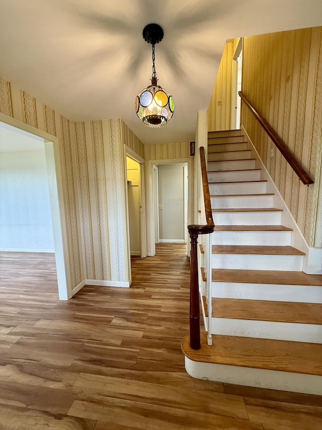 54 Pine Ledge Rd, Bangor, ME 04401 - stairway featuring wallpapered walls and wood finished floors