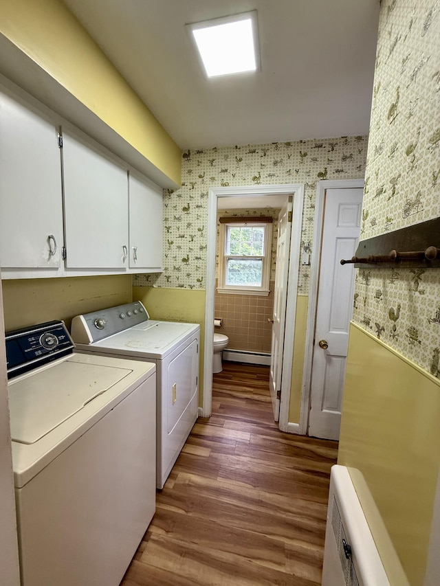 54 Pine Ledge Rd, Bangor, ME 04401 - laundry room with wallpapered walls, independent washer and dryer, baseboard heating, wood finished floors, and cabinet space