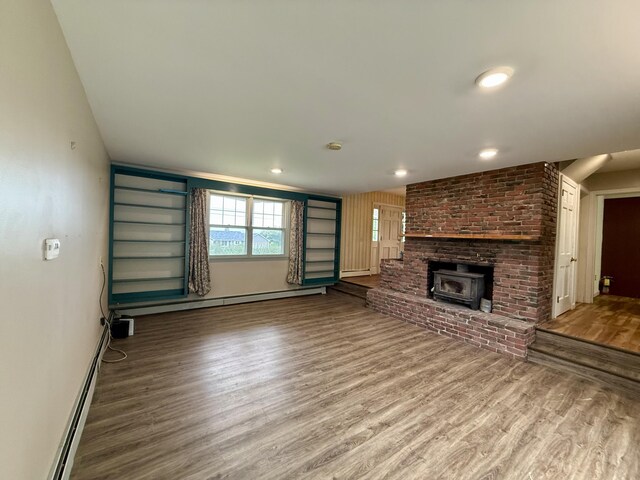 54 Pine Ledge Rd, Bangor, ME 04401 - unfurnished living room with wood finished floors and a baseboard radiator