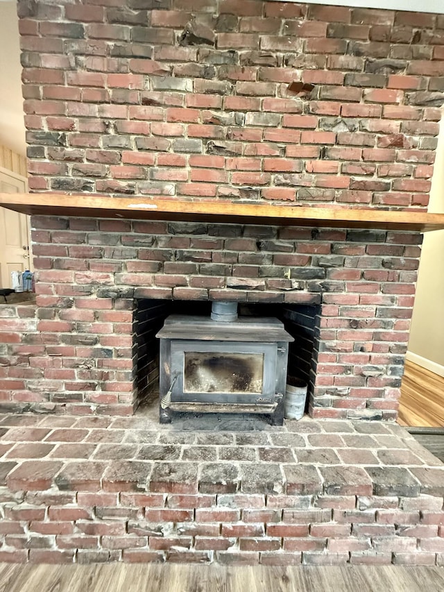 54 Pine Ledge Rd, Bangor, ME 04401 - detailed view of a wood stove and wood finished floors