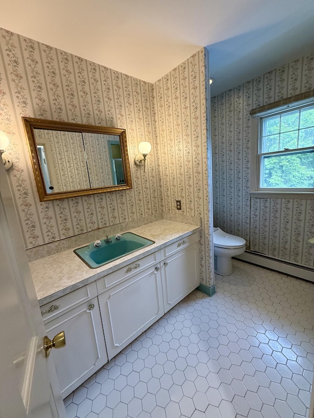 54 Pine Ledge Rd, Bangor, ME 04401 - bathroom with a baseboard heating unit and vanity