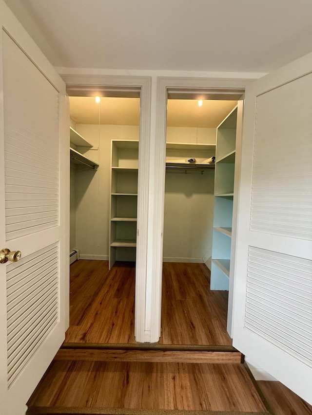 54 Pine Ledge Rd, Bangor, ME 04401 - walk in closet featuring wood finished floors and a baseboard heating unit