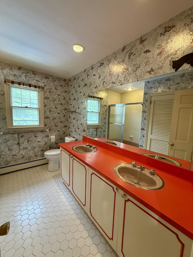 54 Pine Ledge Rd, Bangor, ME 04401 - bathroom with baseboard heating, healthy amount of natural light, double vanity, a shower stall, and wallpapered walls