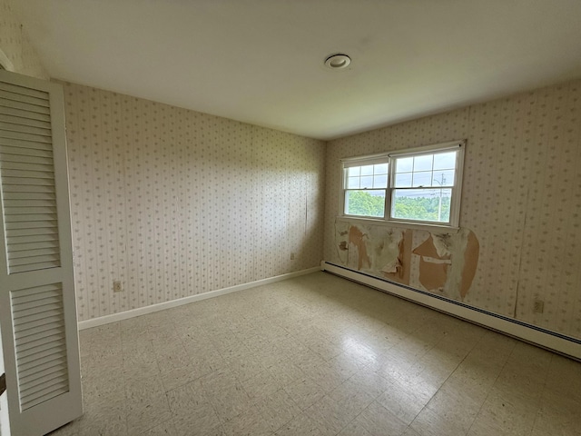 54 Pine Ledge Rd, Bangor, ME 04401 - unfurnished room with wallpapered walls, baseboard heating, and tile patterned floors