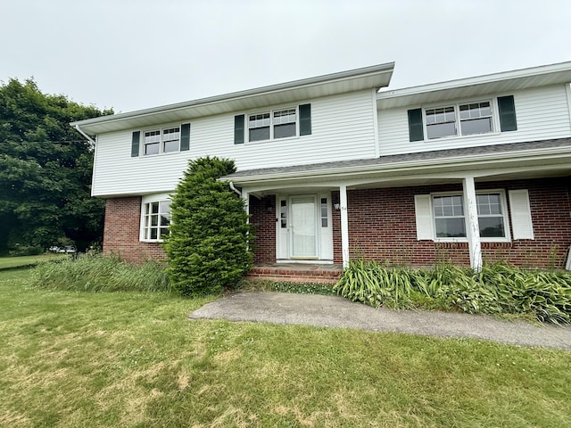 54 Pine Ledge Rd, Bangor, ME 04401 - view of front of house with brick siding and a front yard