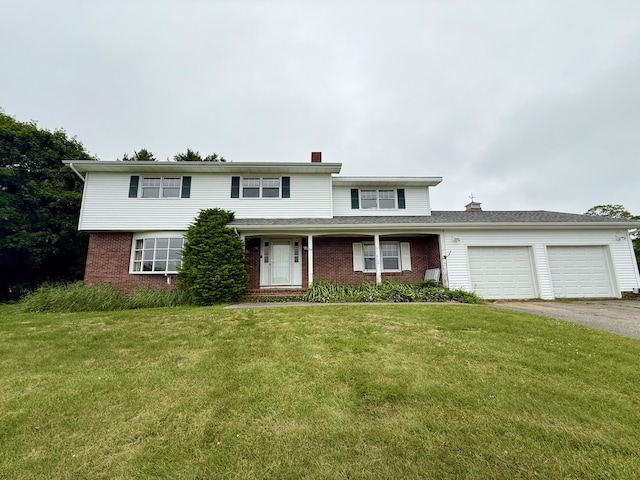 54 Pine Ledge Rd, Bangor, ME 04401 - traditional-style house featuring brick siding, a chimney, an attached garage, and driveway