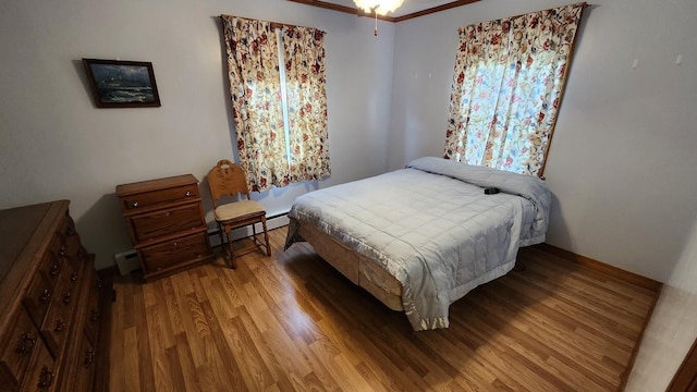 177 Ohio St, Millinocket, ME 04462 - bedroom featuring wood finished floors and baseboard heating