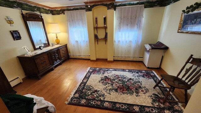 177 Ohio St, Millinocket, ME 04462 - living area featuring baseboard heating and wood finished floors