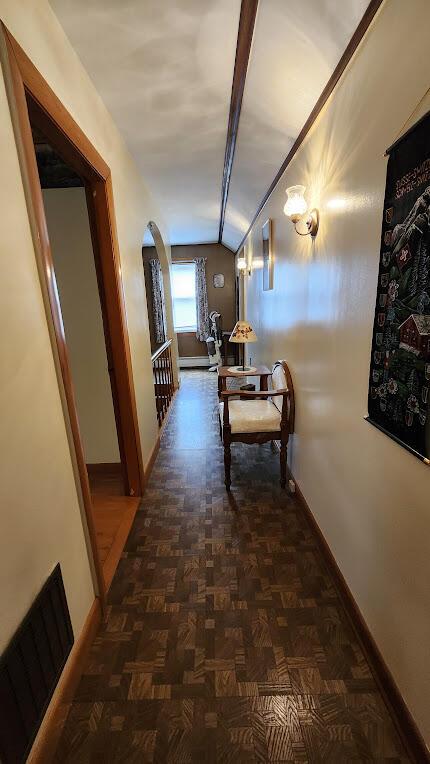 177 Ohio St, Millinocket, ME 04462 - hallway featuring lofted ceiling and arched walkways