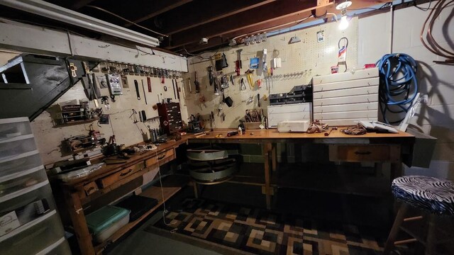 177 Ohio St, Millinocket, ME 04462 - unfinished below grade area with a workshop area