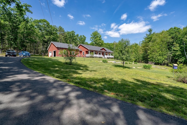 172 Hoxie Hill Rd, Orrington, ME 04474 - ranch-style home featuring a front lawn, a view of trees, and a garage