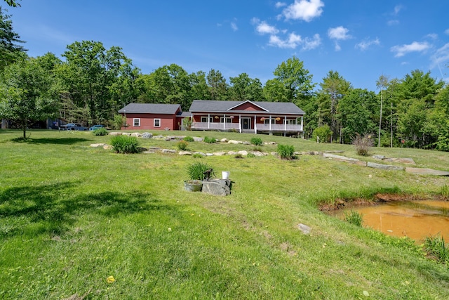 172 Hoxie Hill Rd, Orrington, ME 04474 - rear view of house with a lawn and covered porch