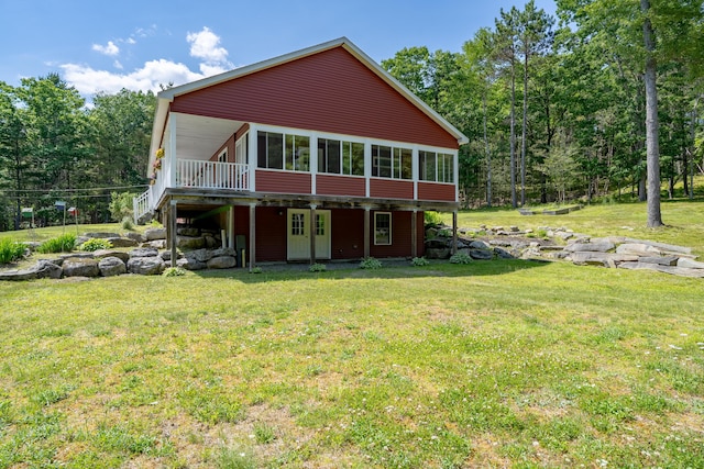 172 Hoxie Hill Rd, Orrington, ME 04474 - rear view of property featuring a wooden deck and a lawn